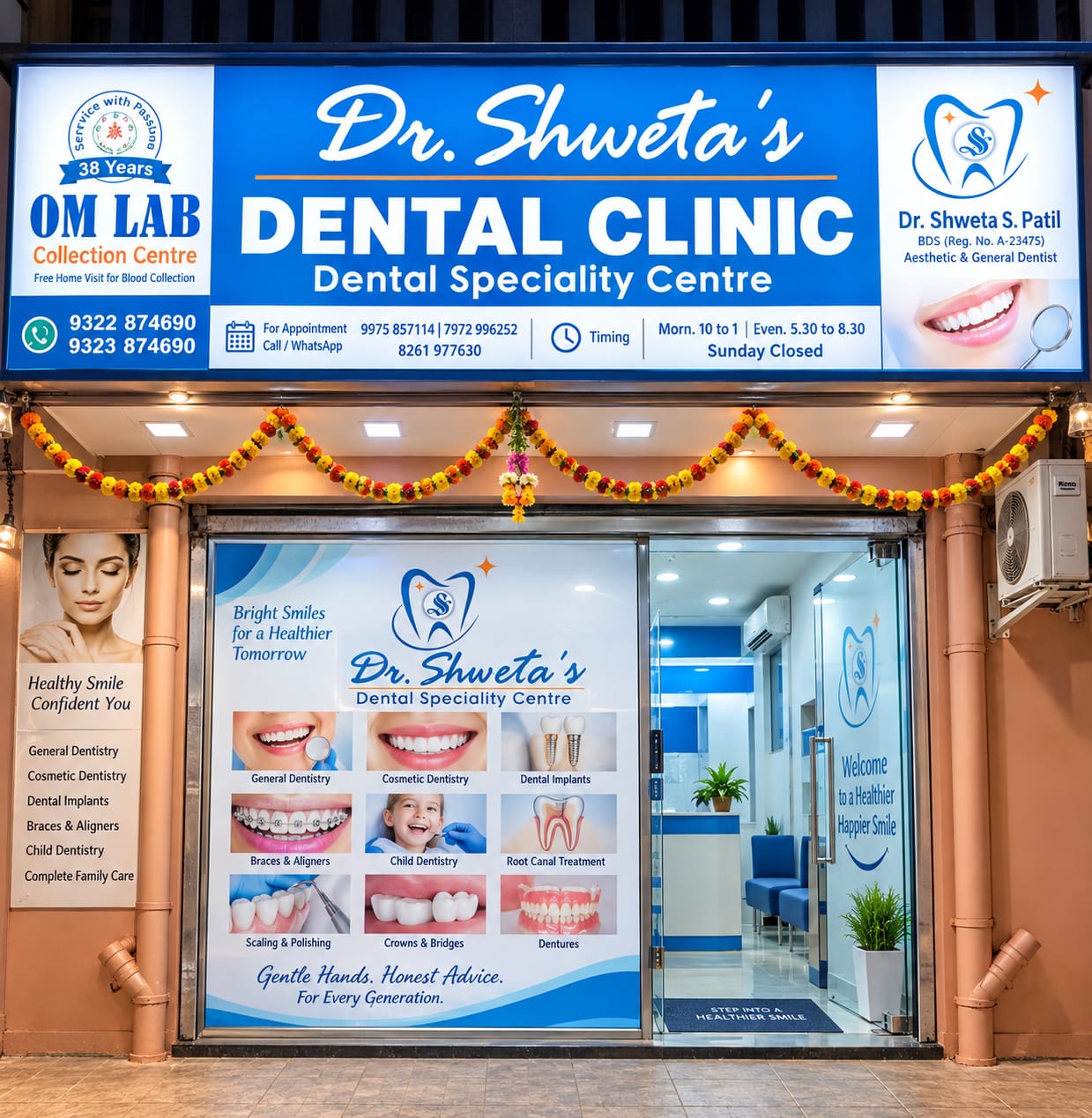 Illuminated blue and white signboard and glass entrance of Dr. Shweta's Dental Speciality Centre in Ambernath